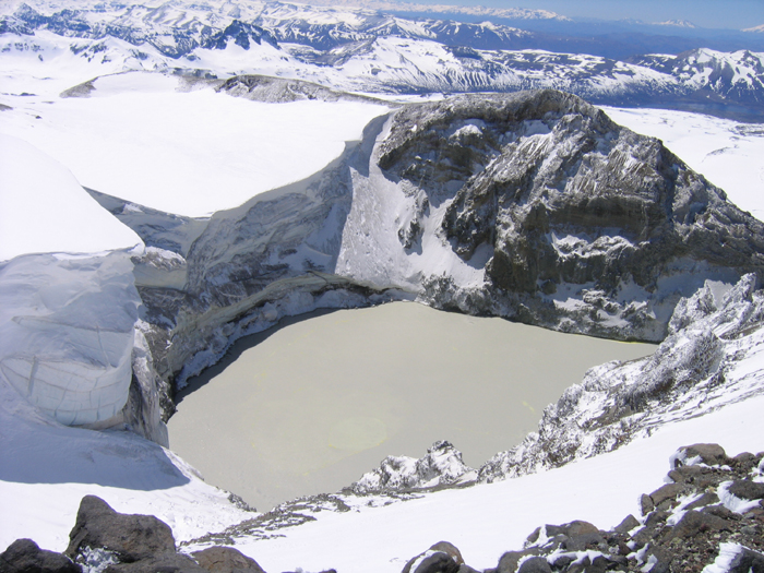 The massive and impressive glacial lake in the crater of Volcan Copahue.